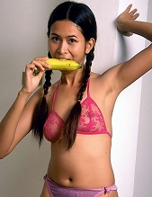 Naughty little asian slut eats banana and open her pussy wide